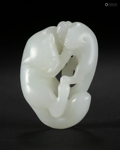 A CARVED HETIAN JADE PENDANT