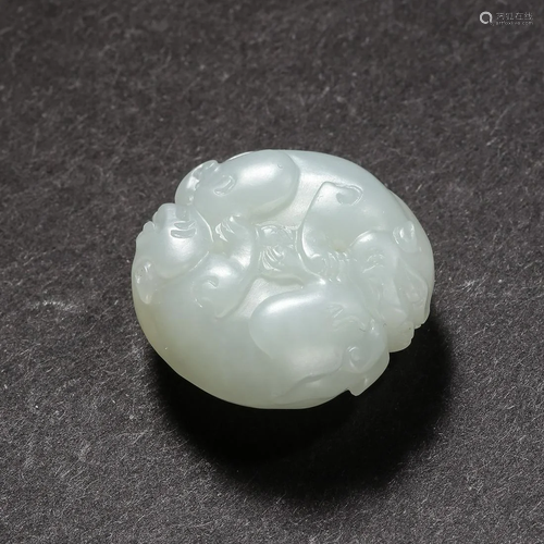 A HETIAN JADE BEAST ORNAMENT