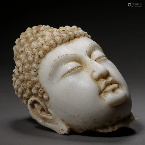 A WHITE JADE BUDDHA HEAD STATUE