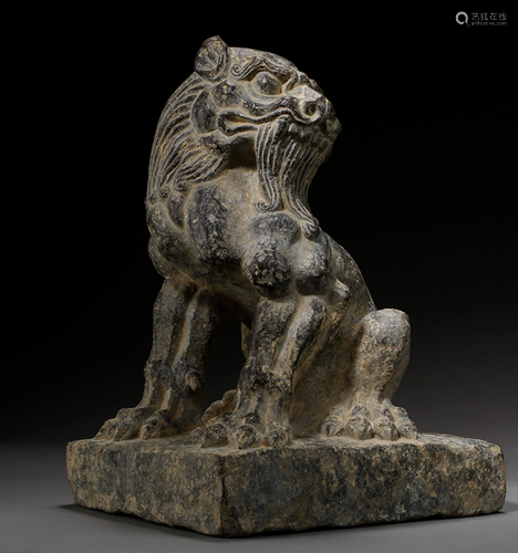 A STONE CARVED LION ORNAMENT