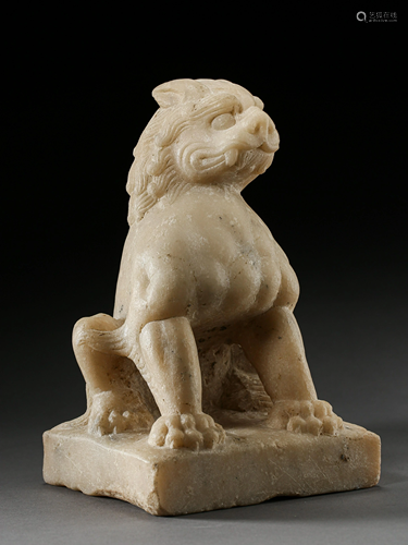 A WHITE JADE LION ORNAMENT