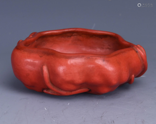 AN IRON RED GLAZED PORCELAIN WATER POT