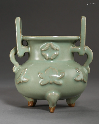 A CELADON GLAZED PORCELAIN THREE-LEGGED CENSER