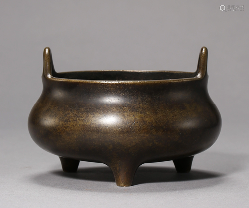 A COPPER DOUBLE-EARED THREE-LEGGED CENSER