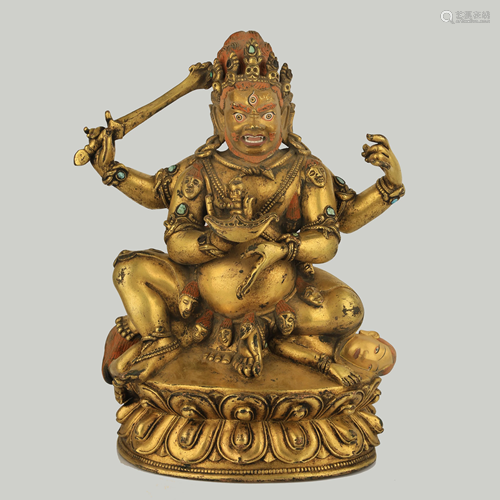 A LARGE INSCRIBED GILT BRONZE FIGURE OF MAHAKALA