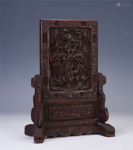 A CHINESE CARVED LACQUERWARE TABLE SCREEN