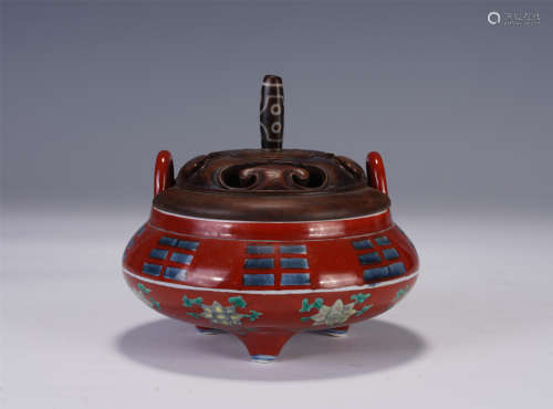 A CHINESE RED GLAZED TRIPOD INCENSE CENSER