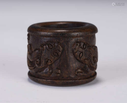 A CHINESE CARVED AGARWOOD ARCHER'S RING