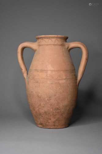 A twin handled pottery jar, possibly 1st-2nd century A.D.