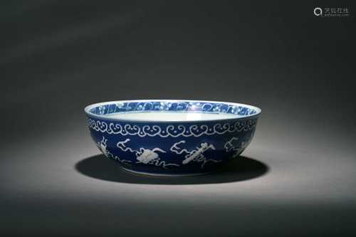 A blue ground reserve-decorated 'abundance' bowl, Qianlong f...