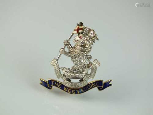 A diamond and enamel regimental brooch