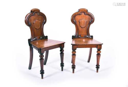 A pair of Regency mahogany hall chairs