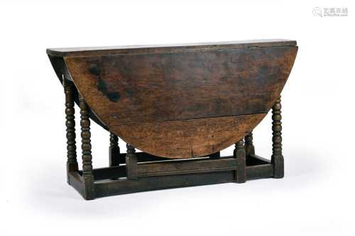A circa 1700 oval, oak gateleg table