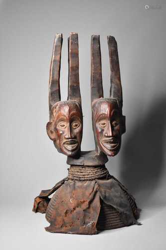 A large African carved wood two-headed effigy, Cameroon