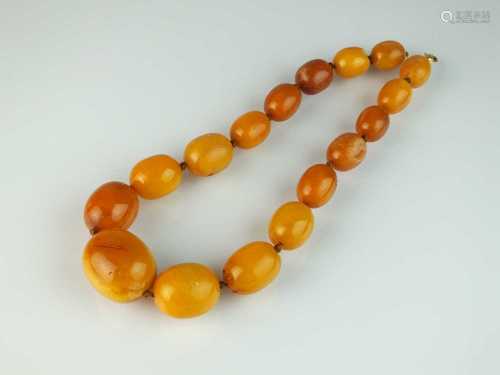A graduated oval amber bead necklace