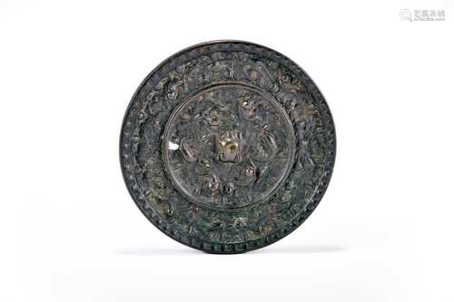 A Chinese bronze Tang style 'lion and grape' mirror