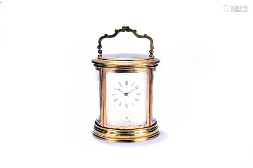 An early 20th century French, oval brass carriage clock