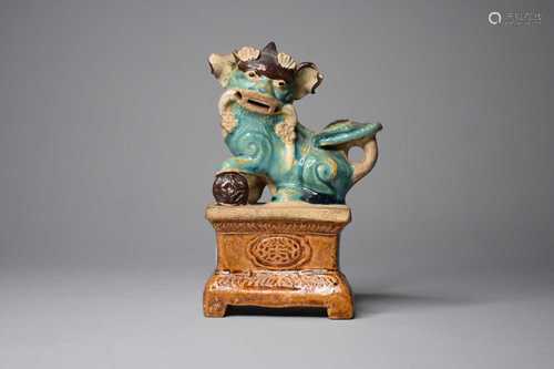 A Chinese sancai style figure of a lion dog