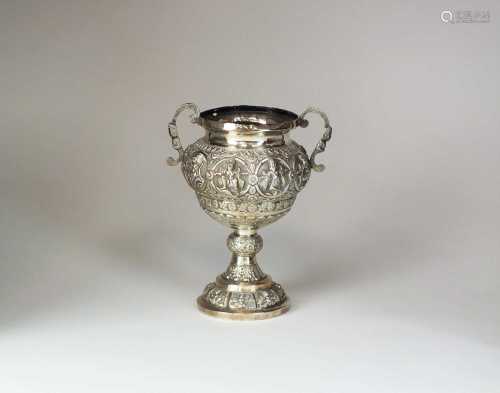 A 19th century Indian white metal twin handled urn