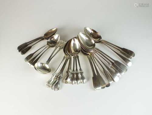 A collection of silver spoons and sauce ladles