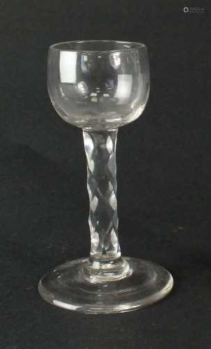 A late 18th-century faceted stem cordial glass