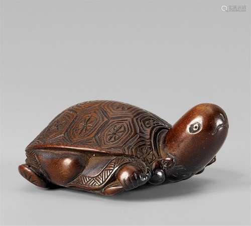 An amusing wood netsuke of Fukurokuju masquerading as a tort...