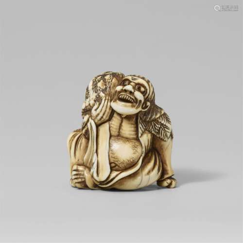 An ivory netsuke of a laughing Gama Sennin with a toad. Late...