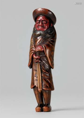 A lacquered wood netsuke of a tall Shoki. 19th century