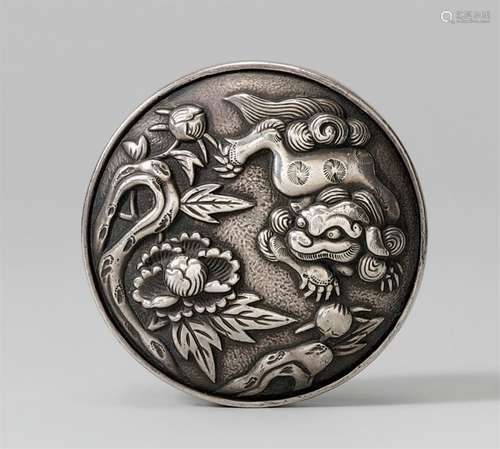 A silver two-part manju of a shishi. Second half 19th centur...