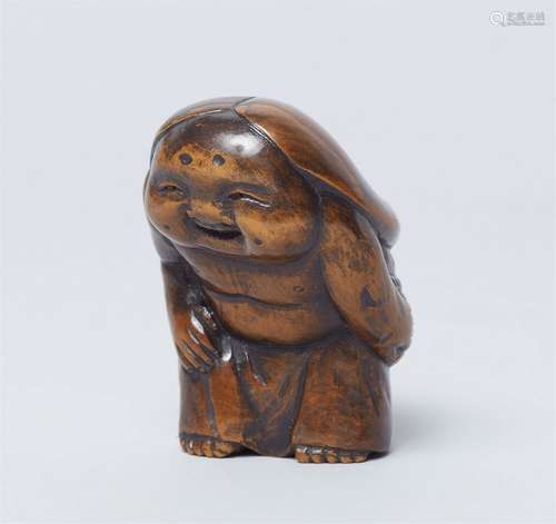 A shunga netsuke of Okame. Boxwood. 19th century