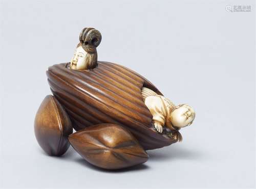 A large wood and ivory okimono netsuke. Second half 19th cen...