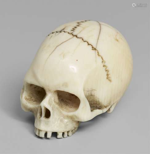 An ivory netsuke of a realistic model of a skull. Late 19th ...