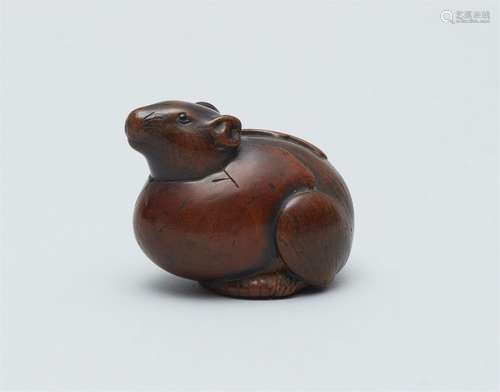 A boxwood netsuke of a rat in an egg. Mid-19th century