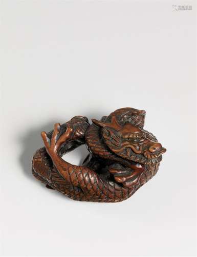 A very large and impressive boxwood netsuke of a mighty two-...