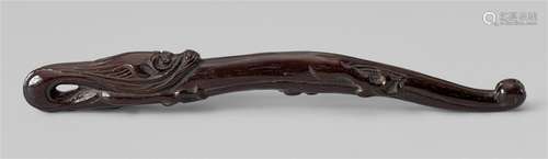 A cherry wood sashi netsuke in shape of an amaryu. 19th cent...