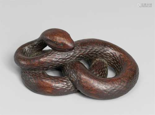 A wood netsuke of a snake. First half 19th century