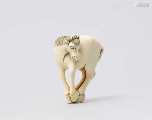 An ivory netsuke of a horse. Late 19th century