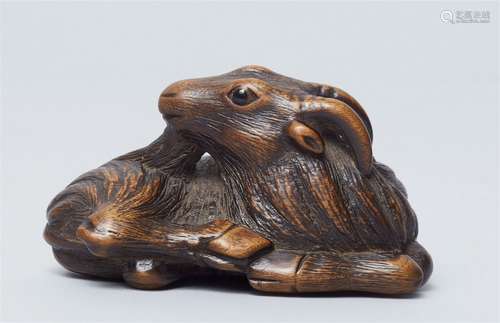 A fine boxwood netsuke of a goat. Late 18th/ early 19th cent...