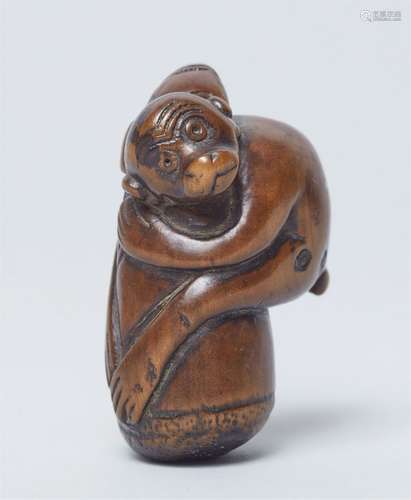 A boxwood netsuke of a monkey. 19th century