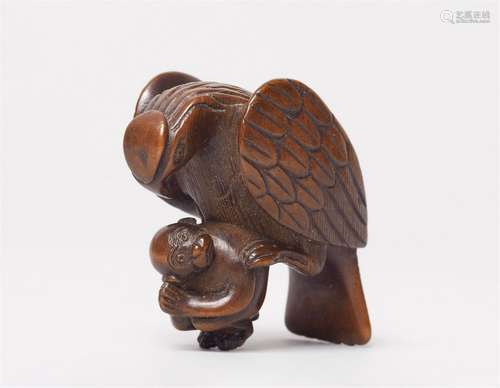 A boxwood netsuke of an eagle with a monkey. 19th century