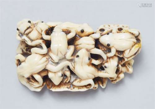 An ivory netsuke of a cluster of frogs. Late 19th century