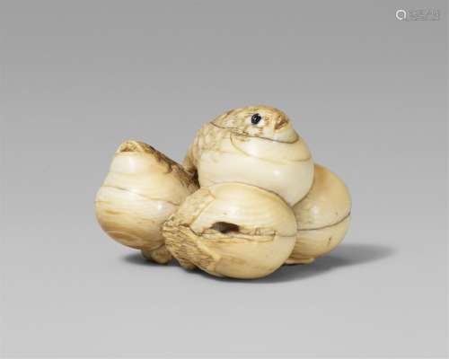 A rare and interesting ivory netsuke of two blowfish and two...