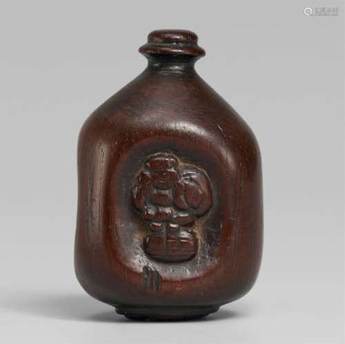 A cherrywood netsuke of a sake bottle (tokkuri). 19th centur...