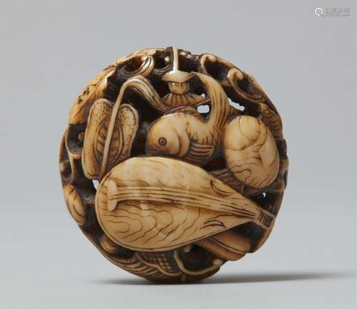 A finely carved walrus tusk ryusa manju. 19th century