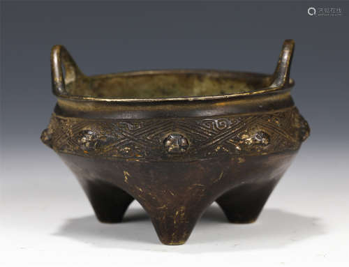 A CHINESE BRONZE TRIPLE FOOT DOUBLE HANDLE INCENSE BURNER