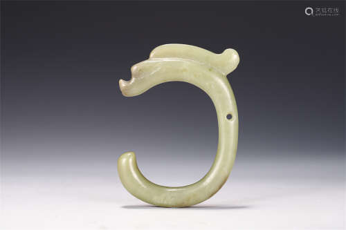 A CHINESE JADE CARVED DRAGON SHAPED DISK PLAQUE