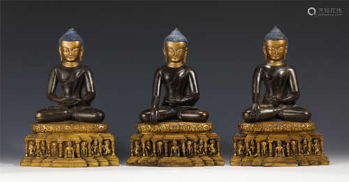 A SET OF THREE CHINESE GILT BRONZE FIGURE OF BUDDHA