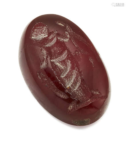 A LOOSE OVAL CARNELIAN INTAGLIO