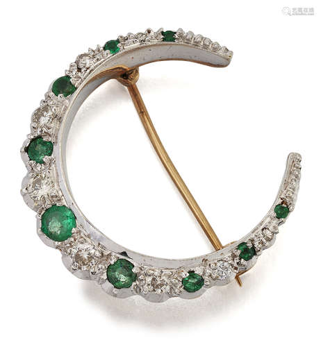 A 9 CARAT WHITE AND YELLOW GOLD EMERALD AND DIAMOND CRESCENT...