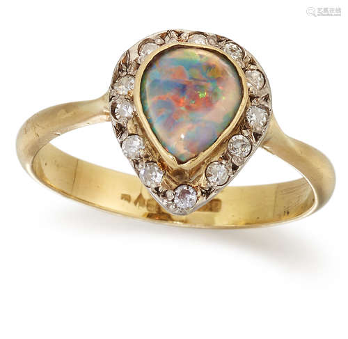 AN 18 CARAT GOLD BLACK OPAL AND DIAMOND CLUSTER RING